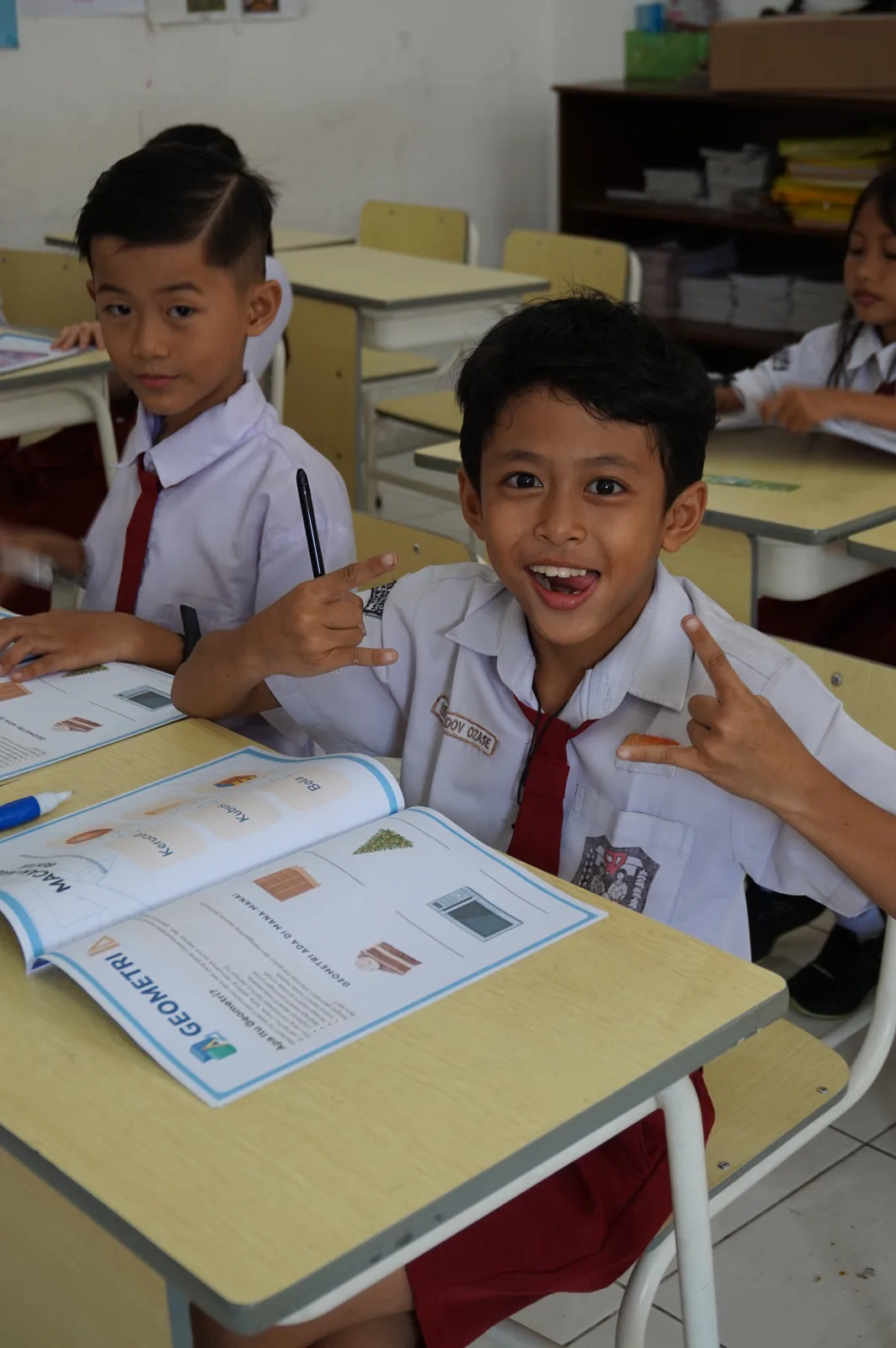 A student exploring a geometry workbook