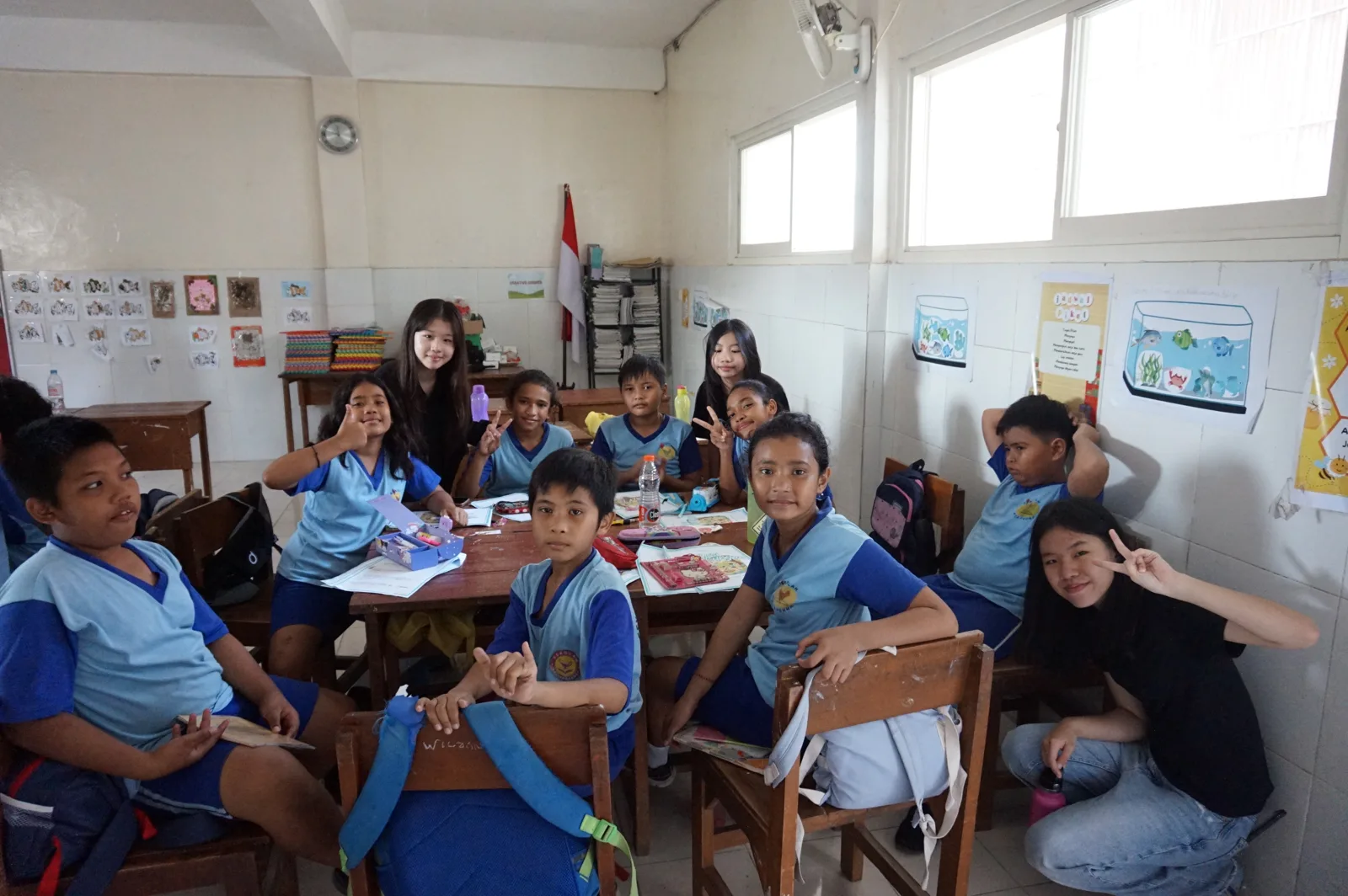 Students and volunteers learning together in a classroom