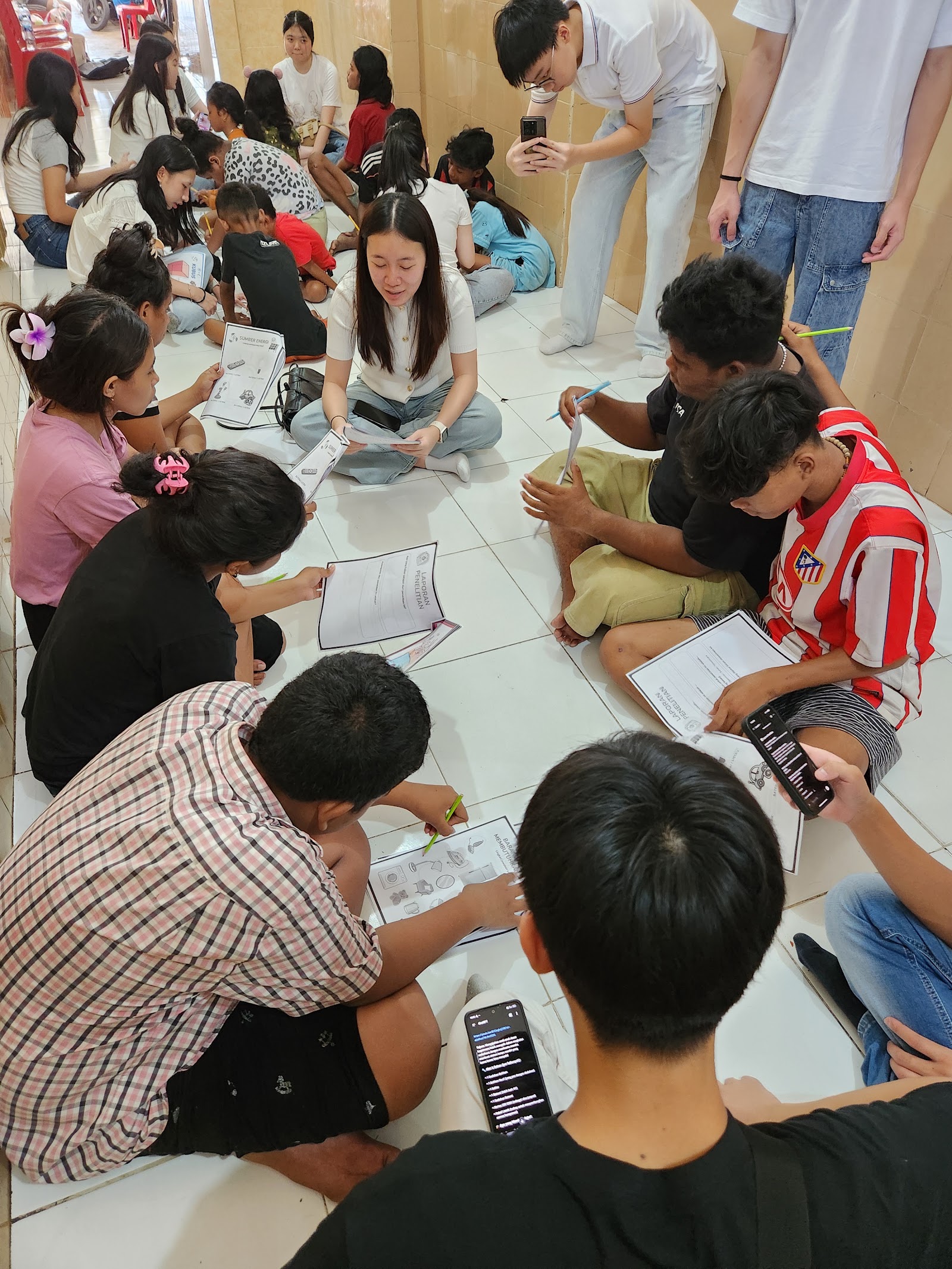 Small groups working on learning activities with volunteers