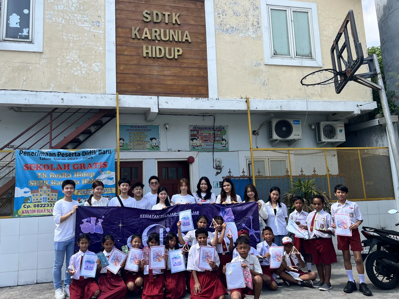 Children and volunteers at a school learning session
