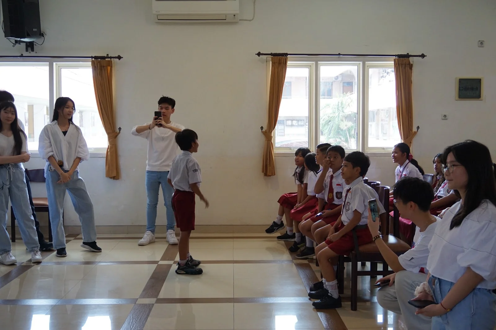 A student sharing with classmates and EclipseLearns volunteers